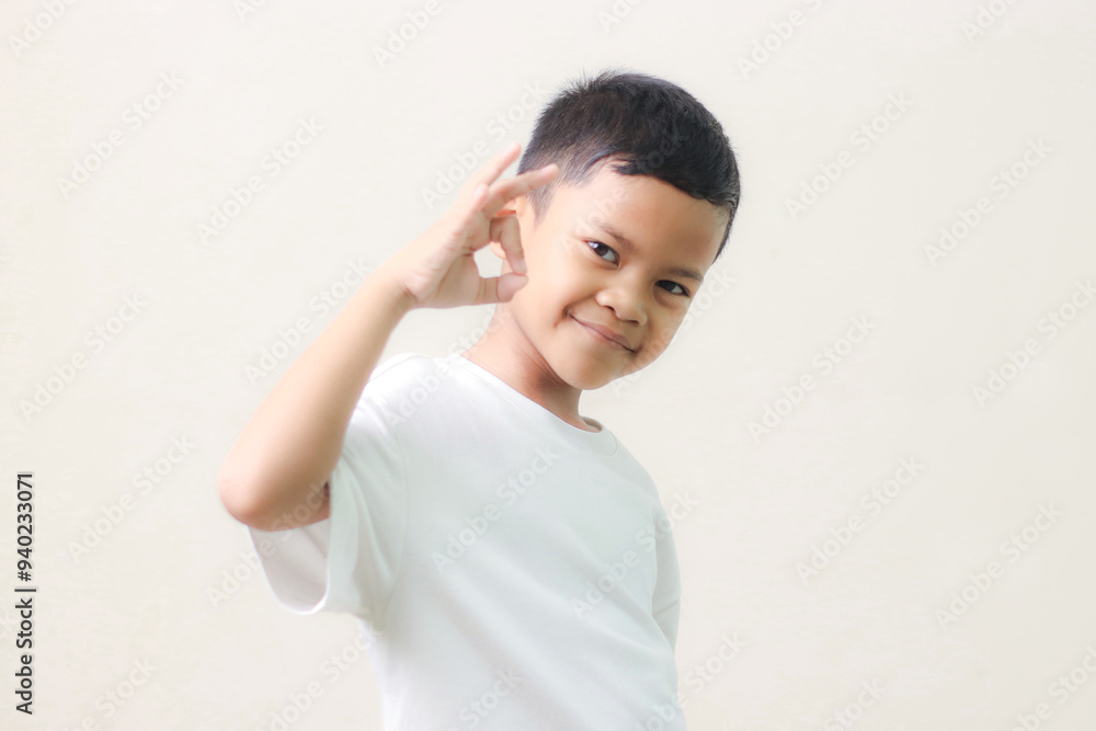 Image of Asian child posing on white background. Image of Asian child posing on white background.