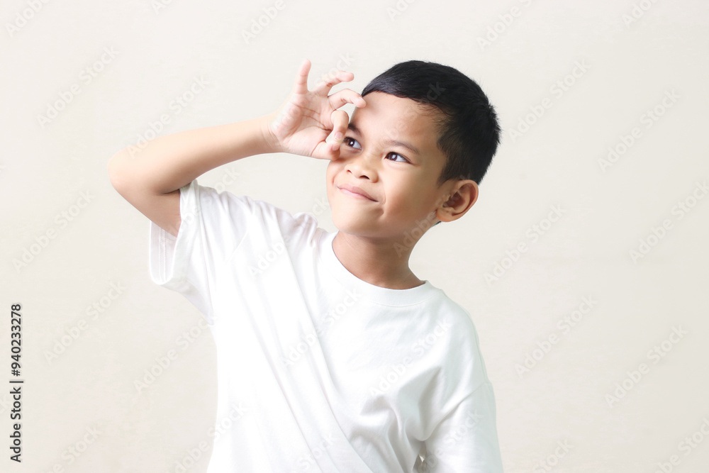 Image of Asian child posing on white background. Image of Asian child posing on white background.