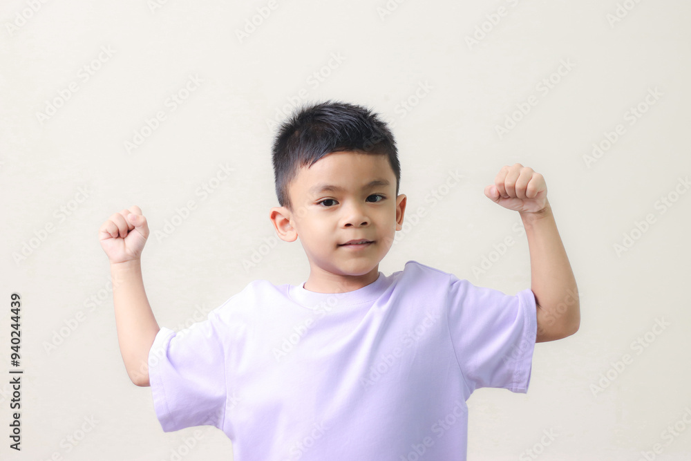 Happy Asian children showing her strong hands. Happy Asian children showing her strong hands.