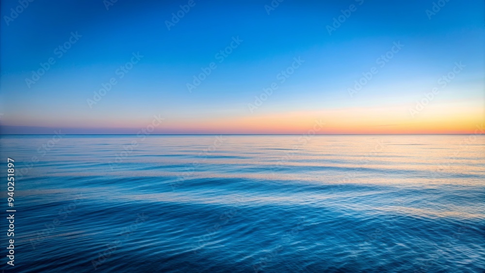 Fototapeta premium Minimalist view of the peaceful blue Pacific Ocean with clear sky at dawn, conveying peace and tranquility