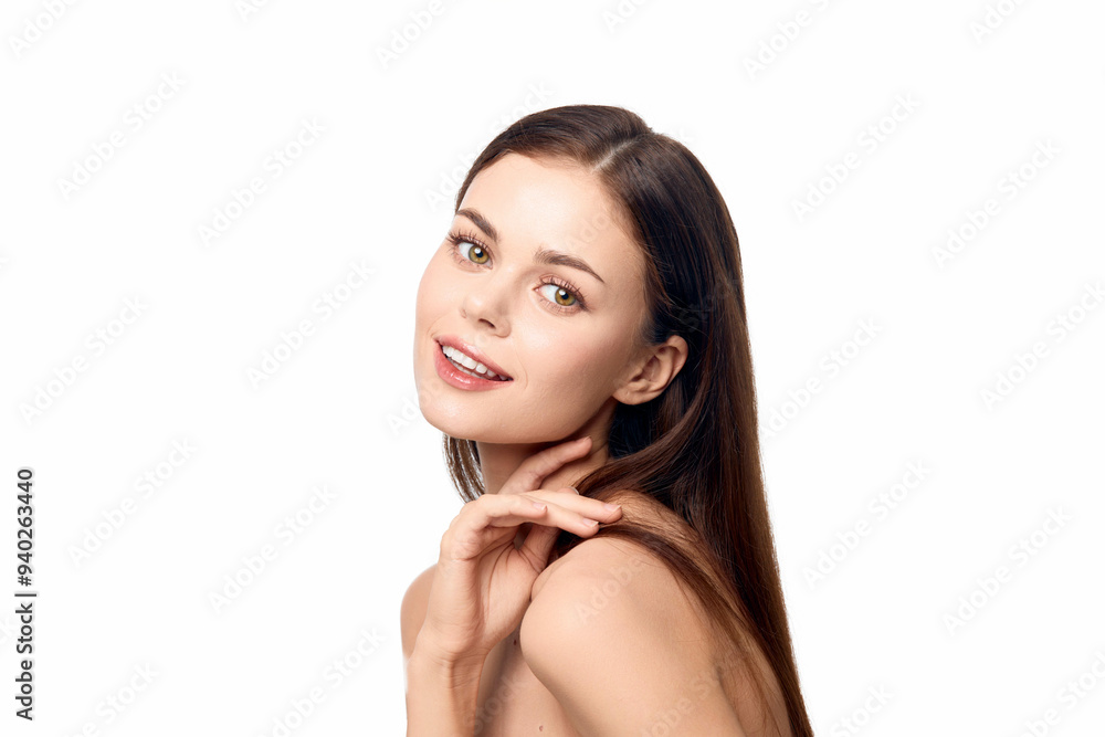 Portrait of a smiling woman with hand on chin looking at the camera against a white background Portrait of a smiling woman with hand on chin looking at the camera against a white background