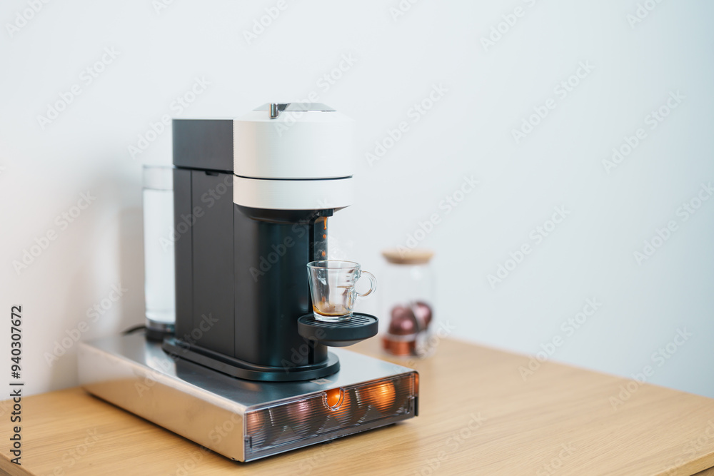 Espresso cup with steam and froth during Coffee making Coffee by Coffee Maker Machine on wood table bar. Cafe shop, Daily beverage drink at Home, Apartment and Office concept Espresso cup with steam and froth during Coffee making Coffee by Coffee Maker Machine on wood table bar. Cafe shop, Daily beverage drink at Home, Apartment and Office concept