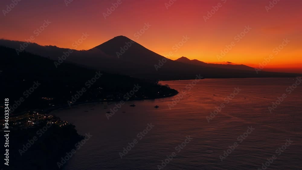 Coastline and volcano mountain on bright sunset. Drone view in Amed, Bali Coastline and volcano mountain on bright sunset. Drone view in Amed, Bali