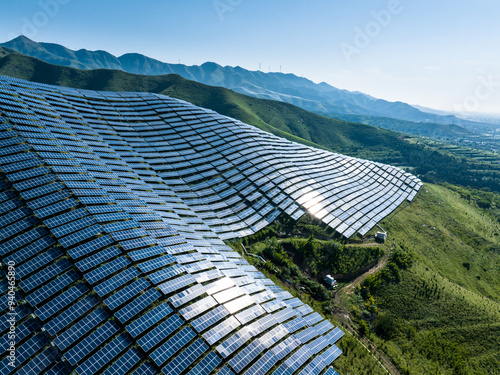 view of solar power station on green hill photo