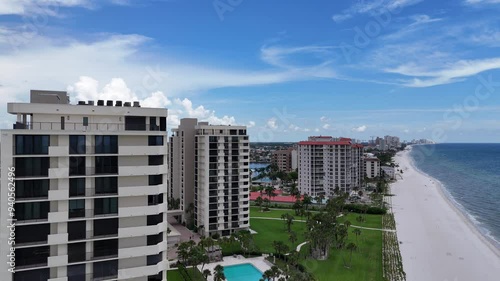 Oceanfront hotel properties and luxury housing in Naples, Florida. Beachfront real estate drone video
