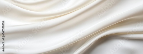  A tight shot of white satin fabric, displaying its uniform wave pattern at the bottom