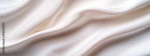  A tight shot of a white fabric with a vaguely defined pattern at its upper and lower edges