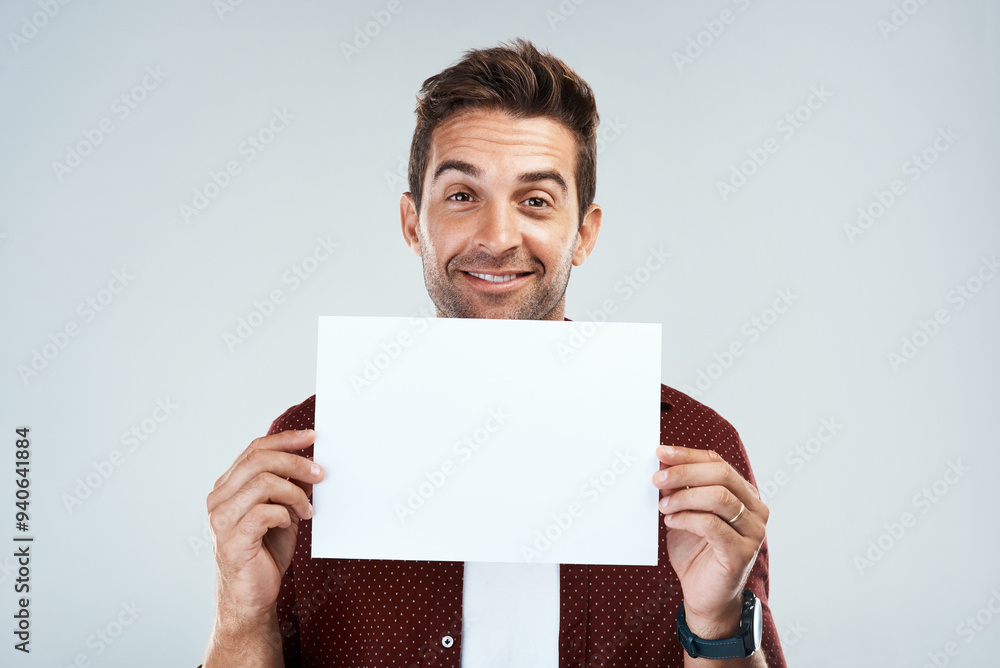 Happy, man and portrait with poster mockup in studio for presenting idea, creative pitch and advertising job opportunity. Person, placard and white background with space for announcement and message. Happy, man and portrait with poster mockup in studio for presenting idea, creative pitch and advertising job opportunity. Person, placard and white background with space for announcement and message.