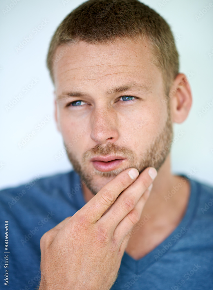 Man, beard and thinking in studio with choice for grooming, skincare or cosmetics by white background. Person, model and ideas with touch for facial hair, decision and routine with hygiene in Germany Man, beard and thinking in studio with choice for grooming, skincare or cosmetics by white background. Person, model and ideas with touch for facial hair, decision and routine with hygiene in Germany