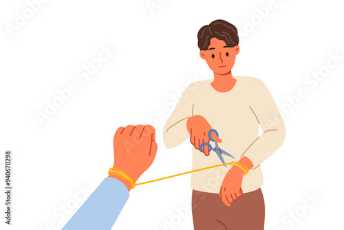 Man breaking up with woman and cuts rope on hand, due to lack of love after betrayal. Breaking up with girlfriend after toxic relationship that negatively affects psychological health