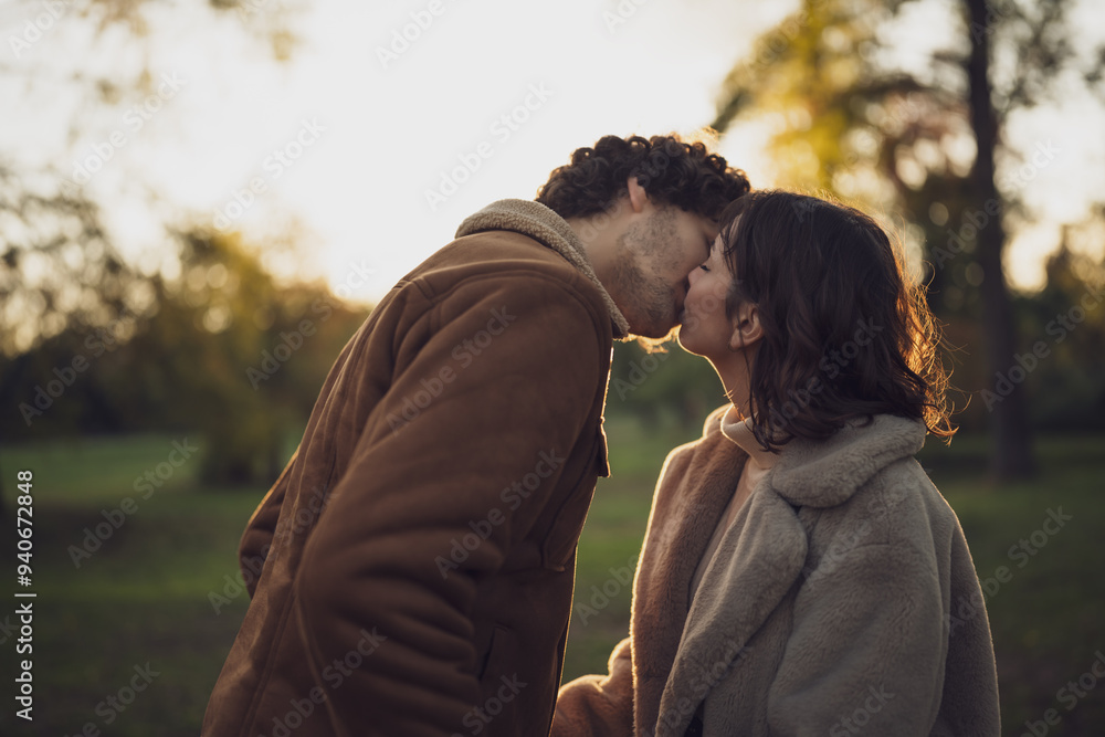 Portrait of happy loving couple in park in sunset. Portrait of happy loving couple in park in sunset.