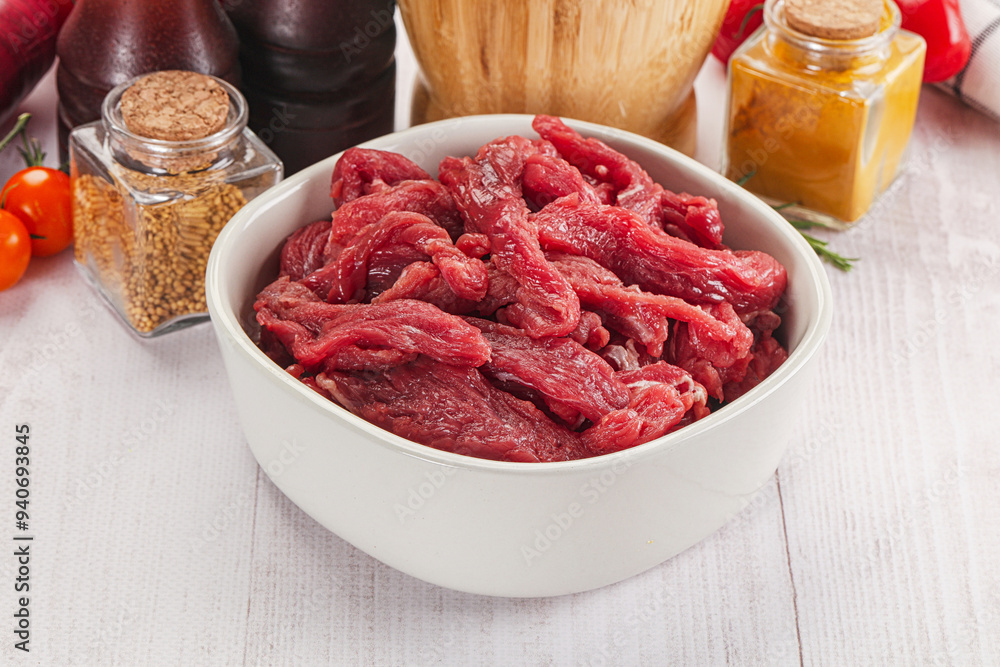 Raw beef meat - sliced strips Raw beef meat - sliced strips