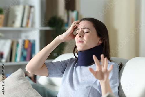 Фотография Dizzy convalescent woman complaining at home
