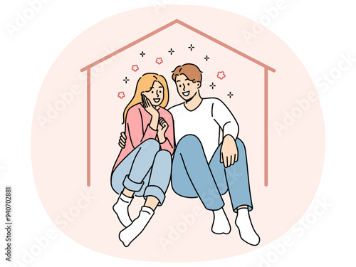 Happy couple sits in imaginary house dreaming of mortgage and buying own property or renting large apartment. Man and woman hugging inside house, using services of real estate insurance