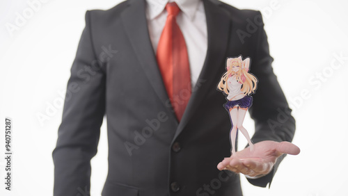 Headless businessman in suit show a figure of sexy anime gamer girl character photo