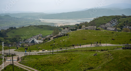 looking down buildings below from a high riding cable car photo