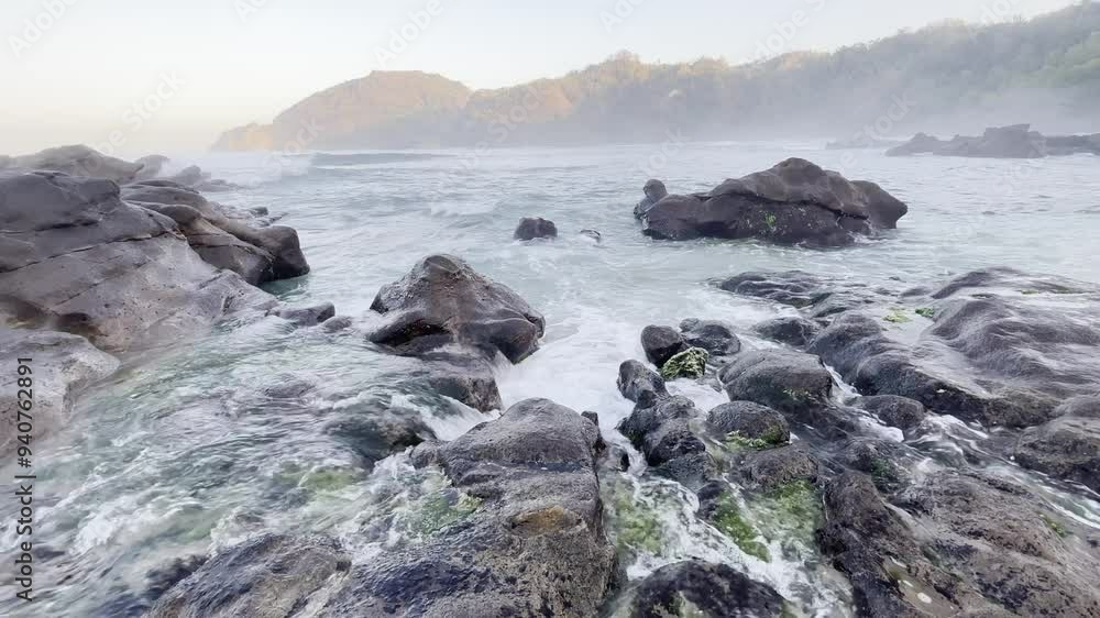 Beach landscape with water splash and mountains Beach landscape with water splash and mountains