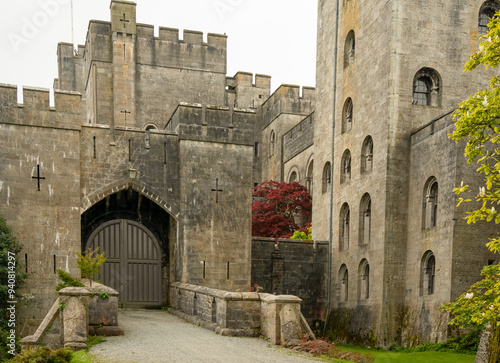 A view of Penrhyn Castle gatehouse, an extensive medieval country house in Llandygai, Bangor, North Wales, in the form of a Norman castle. photo