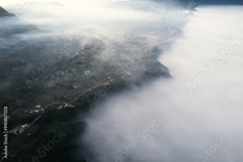 Aerial panoramic view of Indonesia's Bromo volcano and clouds at sunrise