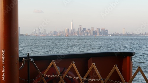 New York City skyline from ferry boat to Staten Island. Manhattan downtown. World Trade Center skyscraper from ferryboat. River waterfront sunset panorama, riverfront buildings architecture, FiDi, USA