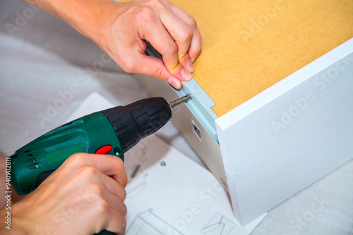 Wallpaper Mural Assembling furniture with electric screwdriver Torontodigital.ca