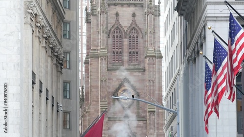 New York City United States. Lower Manhattan Downtown Financial District urban architecture. American Flag, Trinity Church. Wall street Stock Exchange building, USA Stock Market. Hot steam smoke stack photo