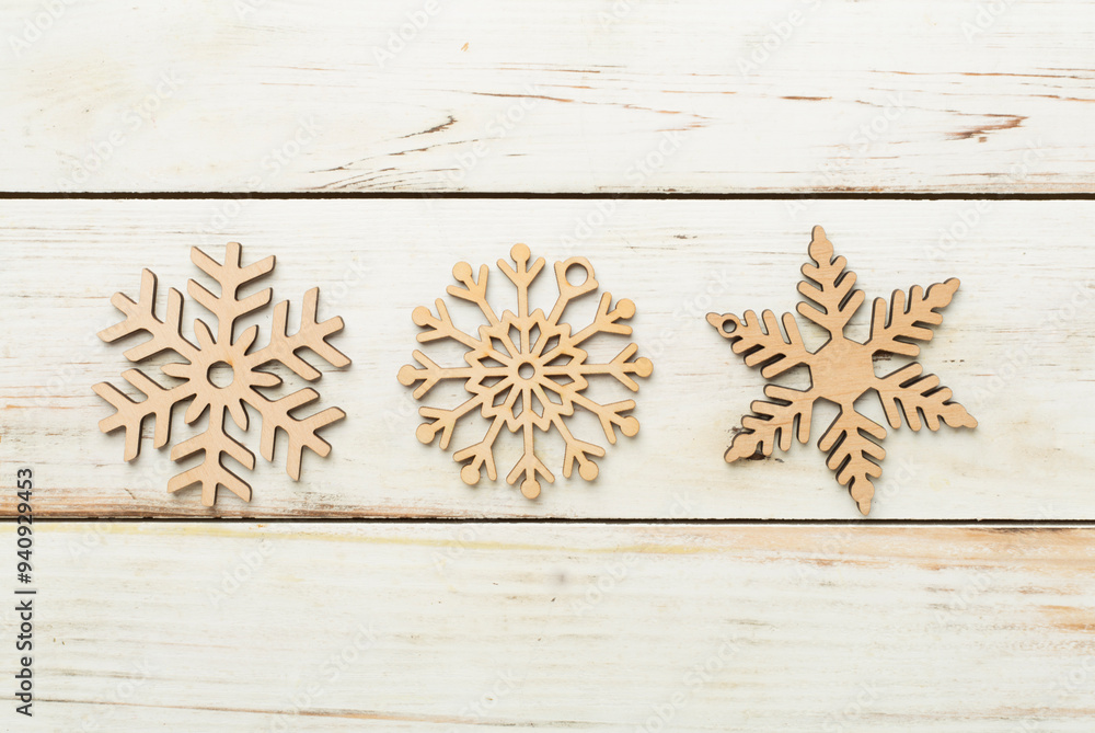 Beautiful snowflake on woden background, top view Beautiful snowflake on woden background, top view