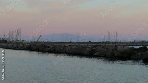 Seagulls flying near breakwater in Salerno