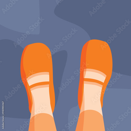 First person view of someone standing on the floor wearing orange shoes