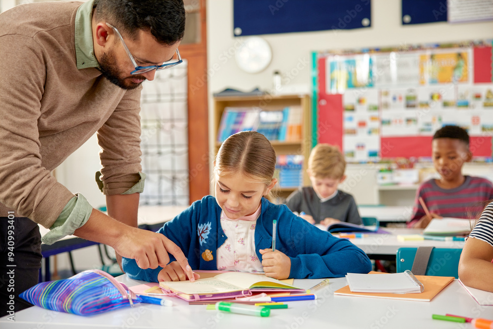 Teacher helping elementary student in classroom Teacher helping elementary student in classroom