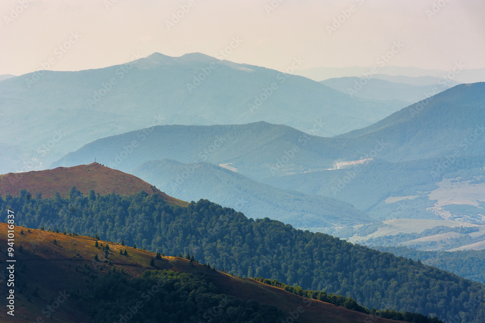 scenery with rolling slopes of borzhava ridge. scenic carpathian mountain landscape in dappled light. view in to the distant valley of transcarpathia in late summer