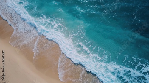 video from an aerial drone showing waves in the ocean coming ashore.Drone flying above the beach. View of the beach, clear and turquoise at the top. Gorgeous beach