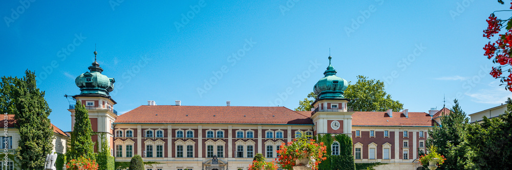 A banner showing a beautiful castle in Łańcut against the blue sky