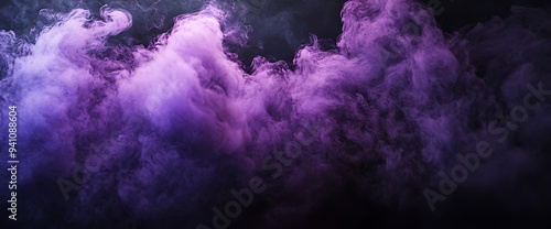 Abstract purple and blue smoke cloud on a black background.