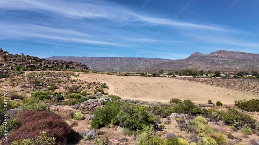 Clanwilliam Cedarberg South Africa. 27.03.2024. Video. Picturesque view across Agter Pakhuis valley of wheat vines and camping ground at Rocklands Cedarberg. Clanwilliam Cedarberg South Africa. 27.03.2024. Video. Picturesque view across Agter Pakhuis valley of wheat vines and camping ground at Rocklands Cedarberg.