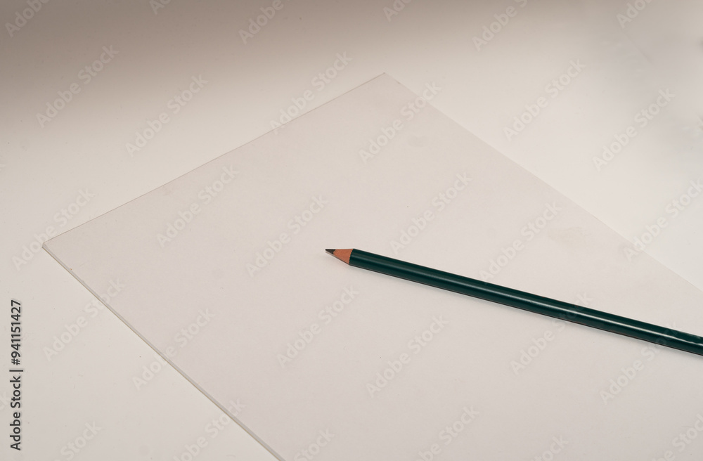 pencil and white paper in white background pencil and white paper in white background
