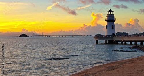 Beautiful coastline and lighthouse building landscape at sunrise in Zhuhai, China. Famous holiday resort.