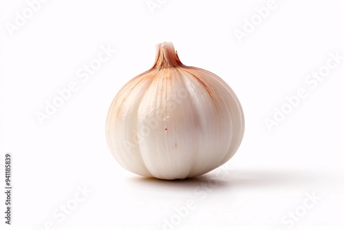 Single garlic bulb isolated on white background.