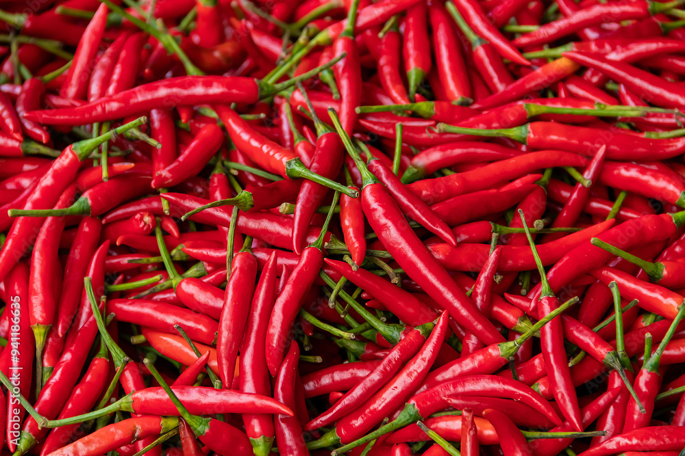Pile of red spicy chili peppers at fresh market in Thailand. Pile of red spicy chili peppers at fresh market in Thailand.