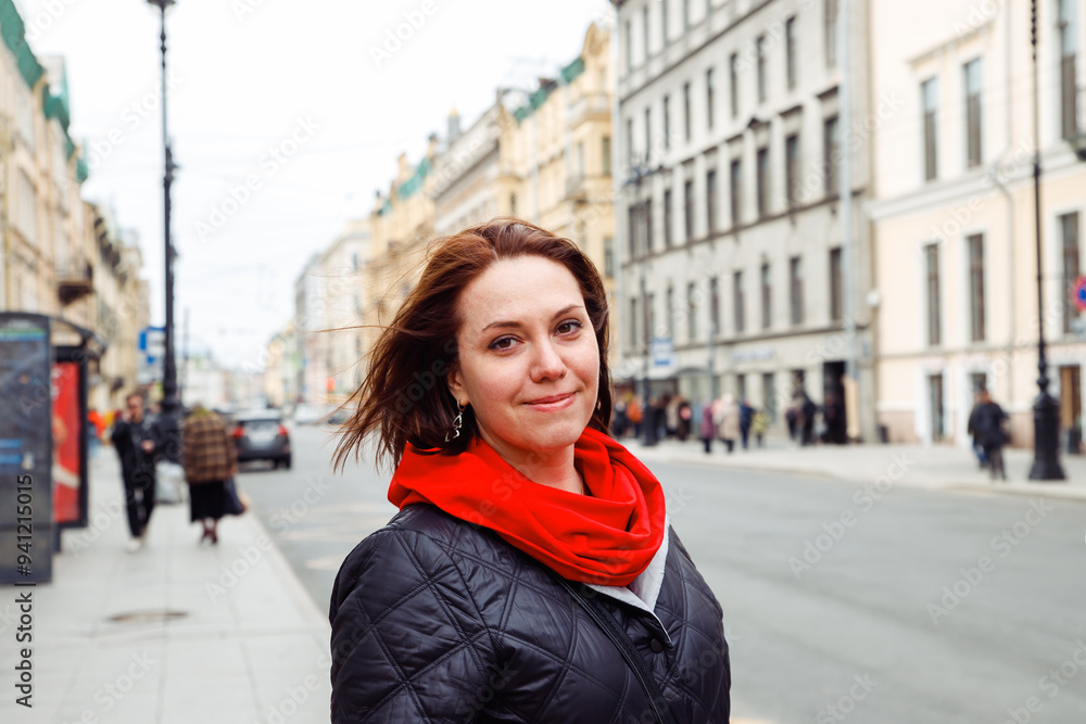 smiling young caucasian female woman at bus stop on street of european historical city. interior designer, architect, businesswoman. positive emotion, sad smile, tourism, lifestyle portrait smiling young caucasian female woman at bus stop on street of european historical city. interior designer, architect, businesswoman. positive emotion, sad smile, tourism, lifestyle portrait