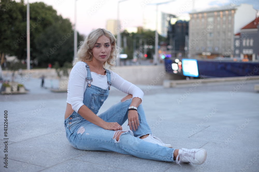 Fototapeta premium Beautiful woman posing at the street.