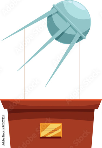 Sputnik satellite model hanging above a museum exhibit stand with a blank plaque