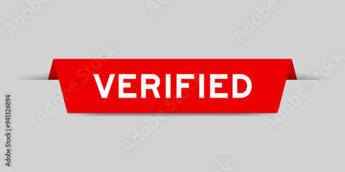 Red color inserted label with word verified on gray background photo