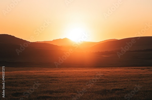 Sunset Over Silhouetted Hills and Valleys