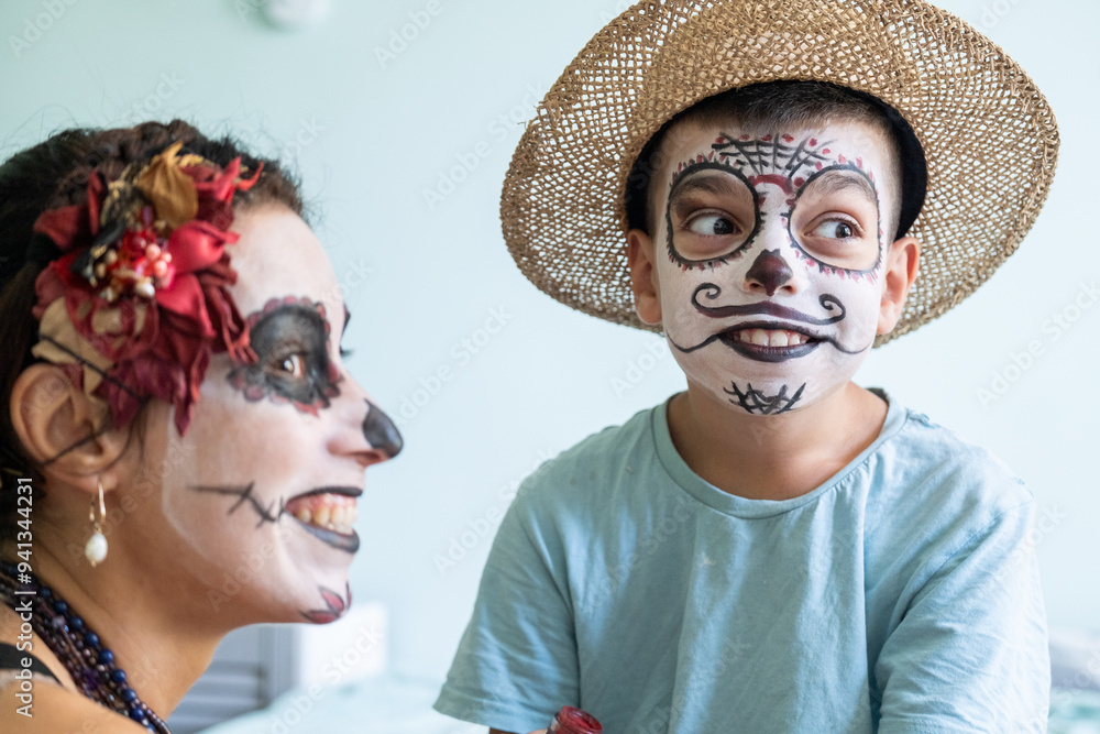 mother puts makeup on son for day of the dead, mexican family, halloween holiday, day of the dead in mexico, skull, laughter joy, brushes, makeup artist, preparing for day of the dead holiday, masquer mother puts makeup on son for day of the dead, mexican family, halloween holiday, day of the dead in mexico, skull, laughter joy, brushes, makeup artist, preparing for day of the dead holiday, masquer