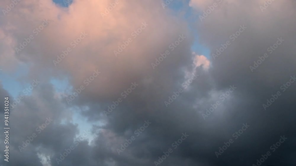 Dark orange and gray clouds moving fast.View of the sky in the evening. 4K, 60Fps. Dark orange and gray clouds moving fast.View of the sky in the evening. 4K, 60Fps.