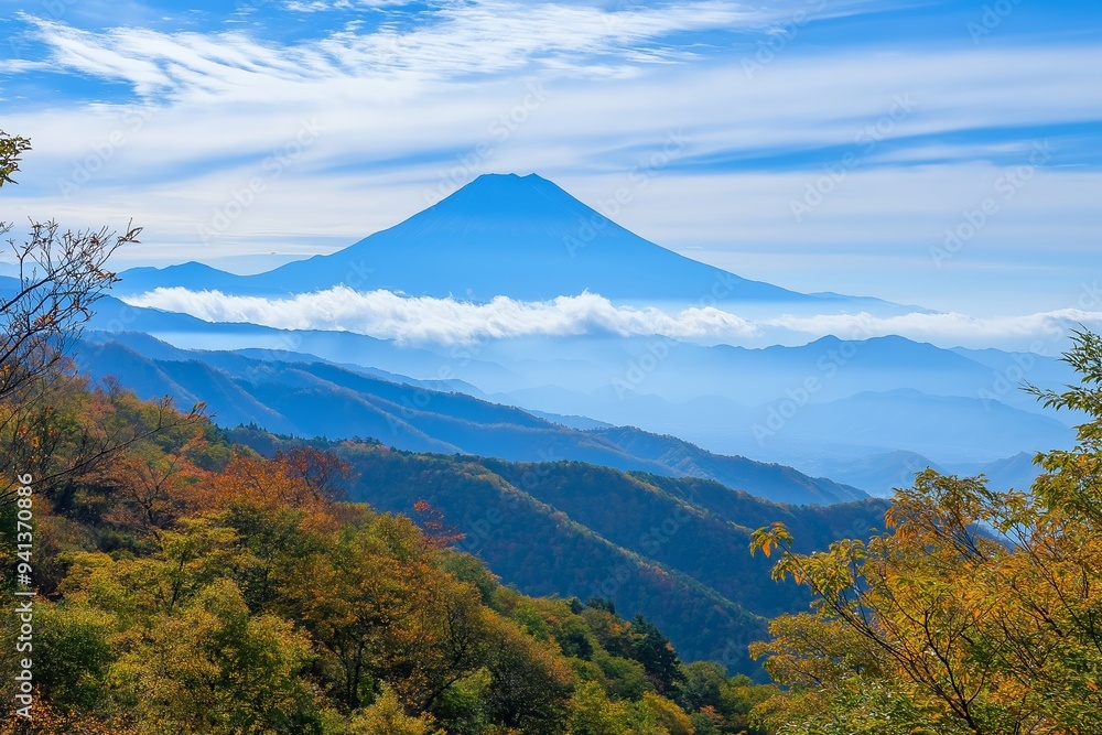 Naklejka premium Amajestic mountain peak standing above a sea of clouds, portraying themes of grandeur, nature, and the beauty of the earth.
