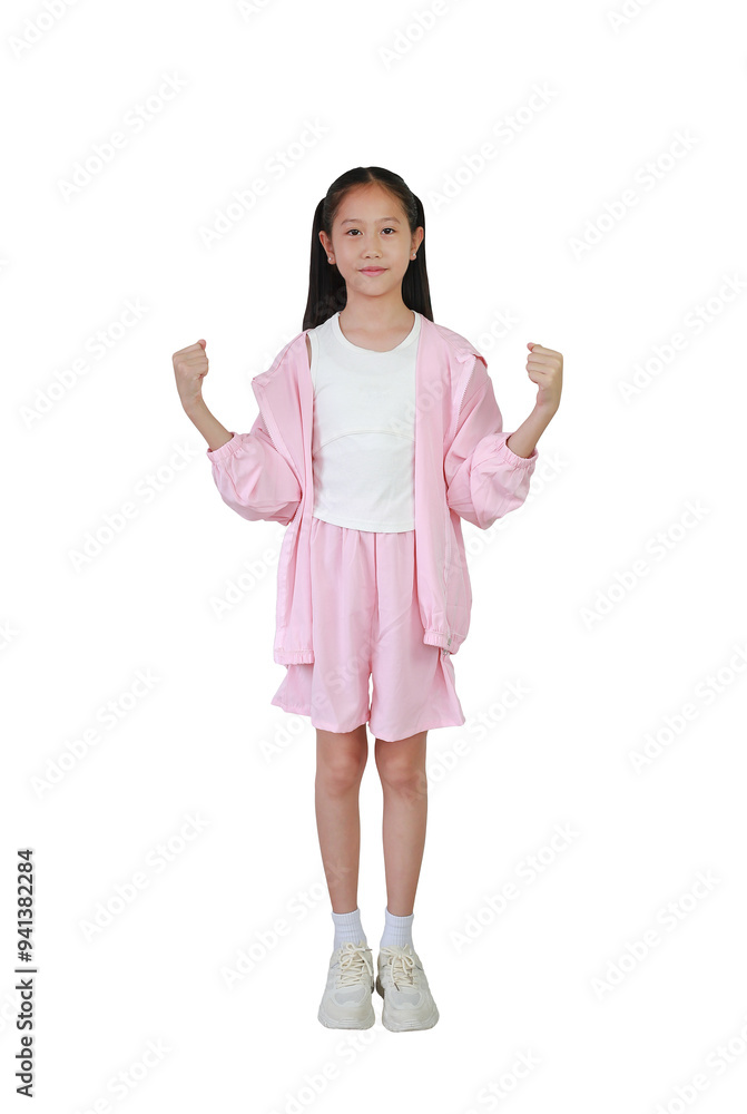 Asian young girl child show strong gesture or success posture while standing isolated on white background. Image full length with Clipping path. Asian young girl child show strong gesture or success posture while standing isolated on white background. Image full length with Clipping path.