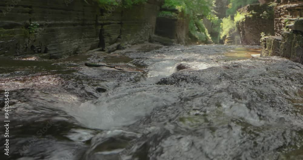 Close up video of storm water flowing within a creek or stream.	