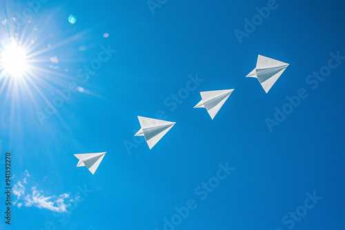 Paper plane flying on blue sky background 